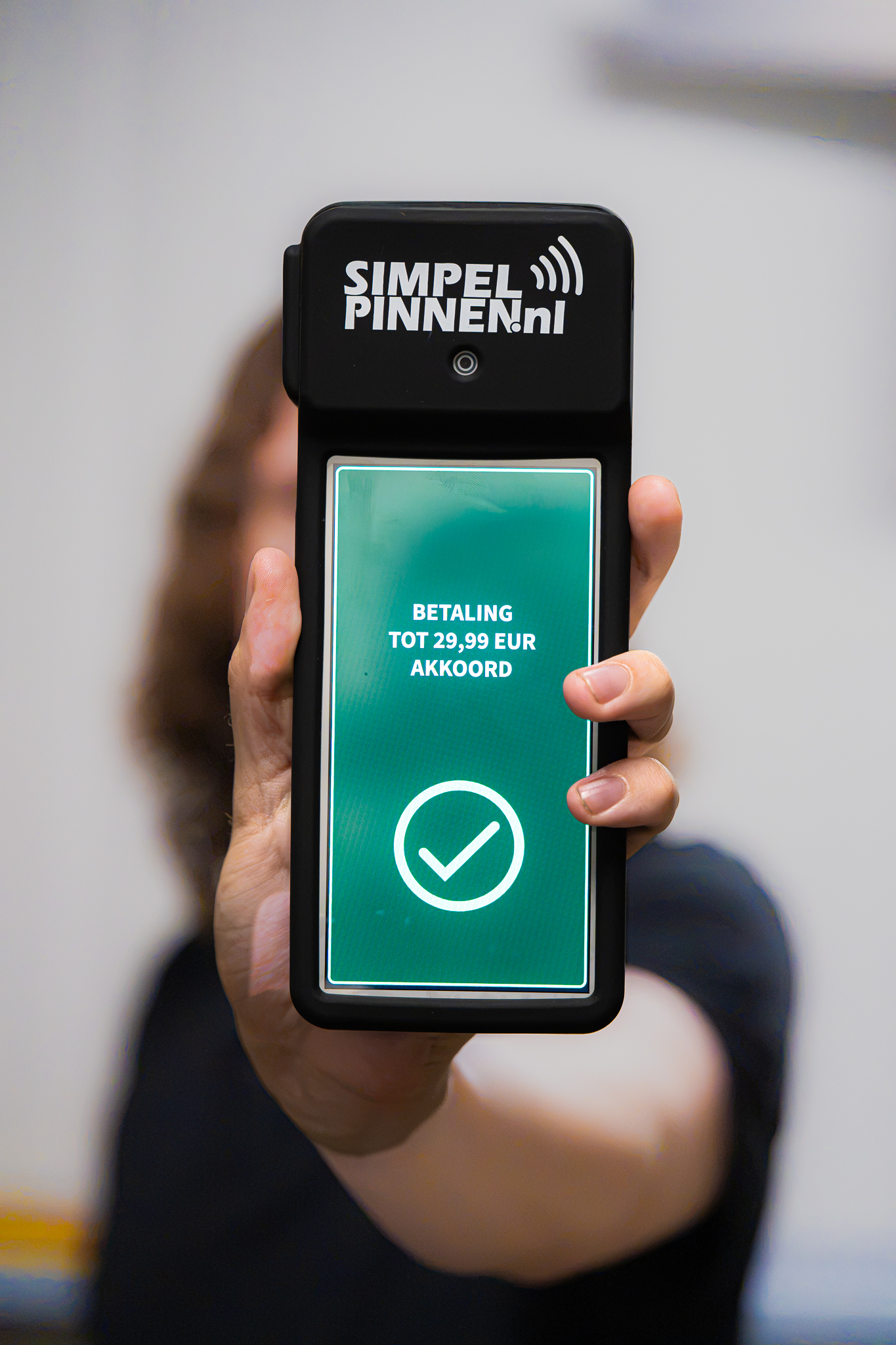 Phone showing an approved payment confirmation screen