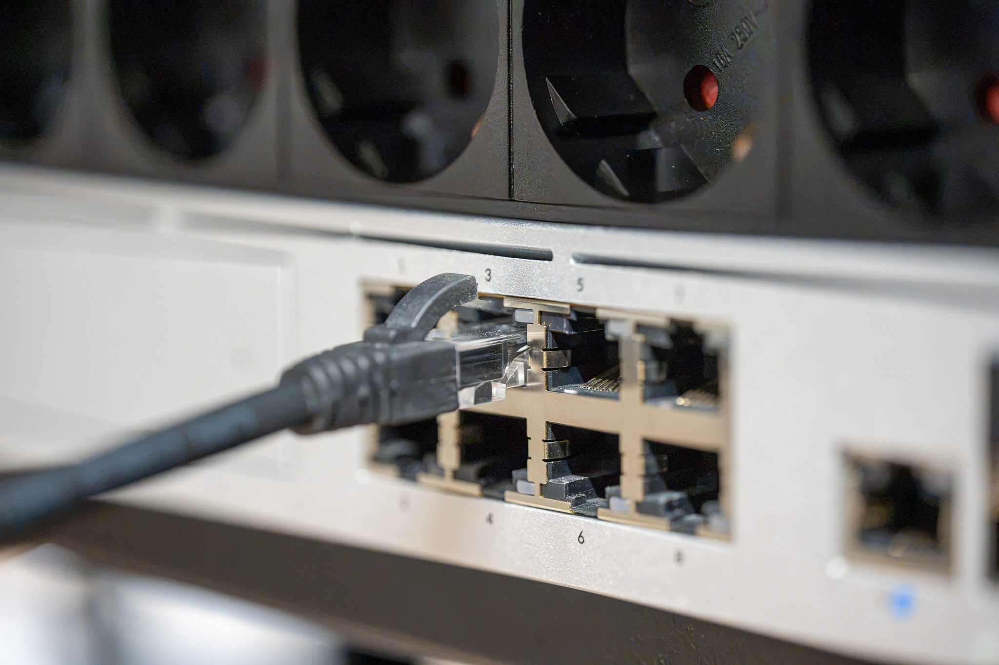 Managed network switch being fitted into a rack