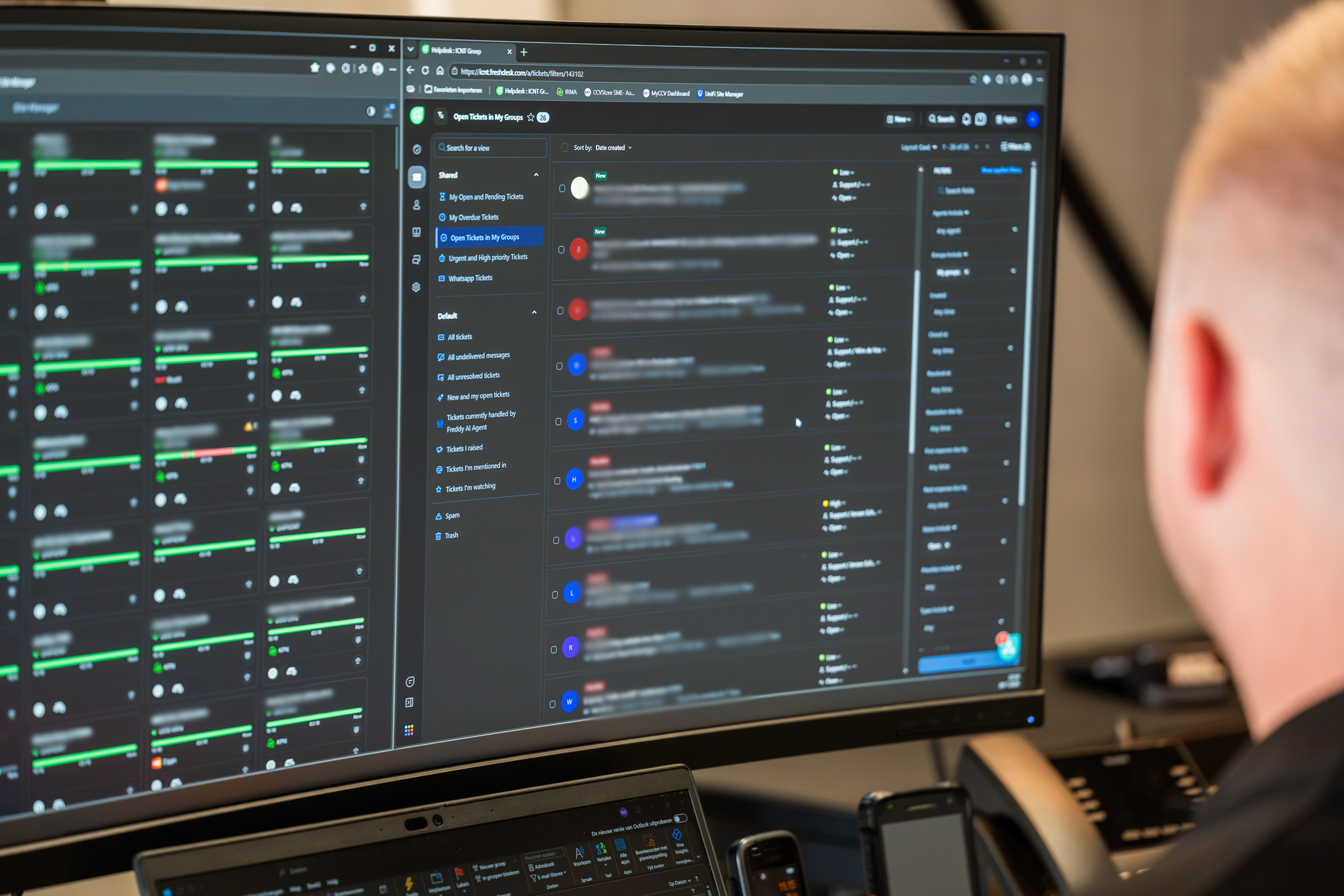 Support console showing device status on a large monitor